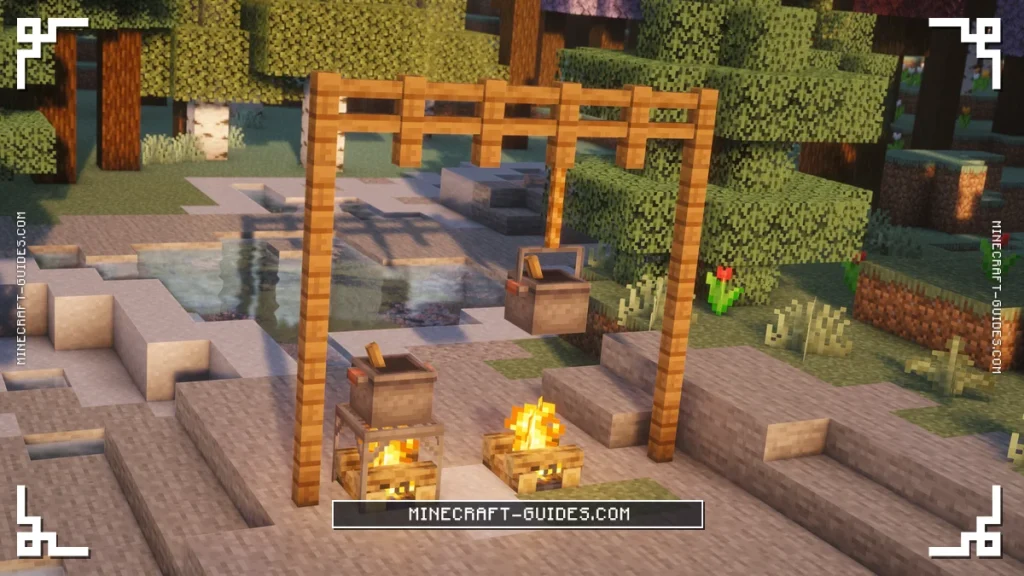 A Cooking Pot on a Campfire tray beside a Cooking Pot hanging from Rope over a second Campfire