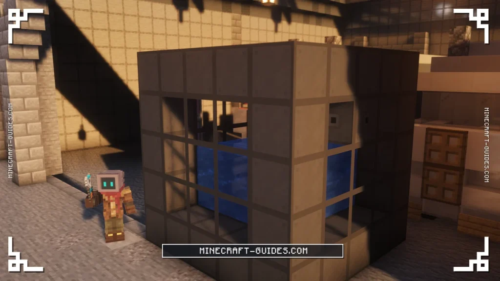 A 5x5x5 Dynamic Tank about half full of Water behind Structural Glass inside a Mekanism hangar