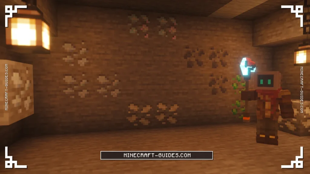 A statue with an Atomic Disassembler in front of Mekanism ore veins in a Lantern-lit mine